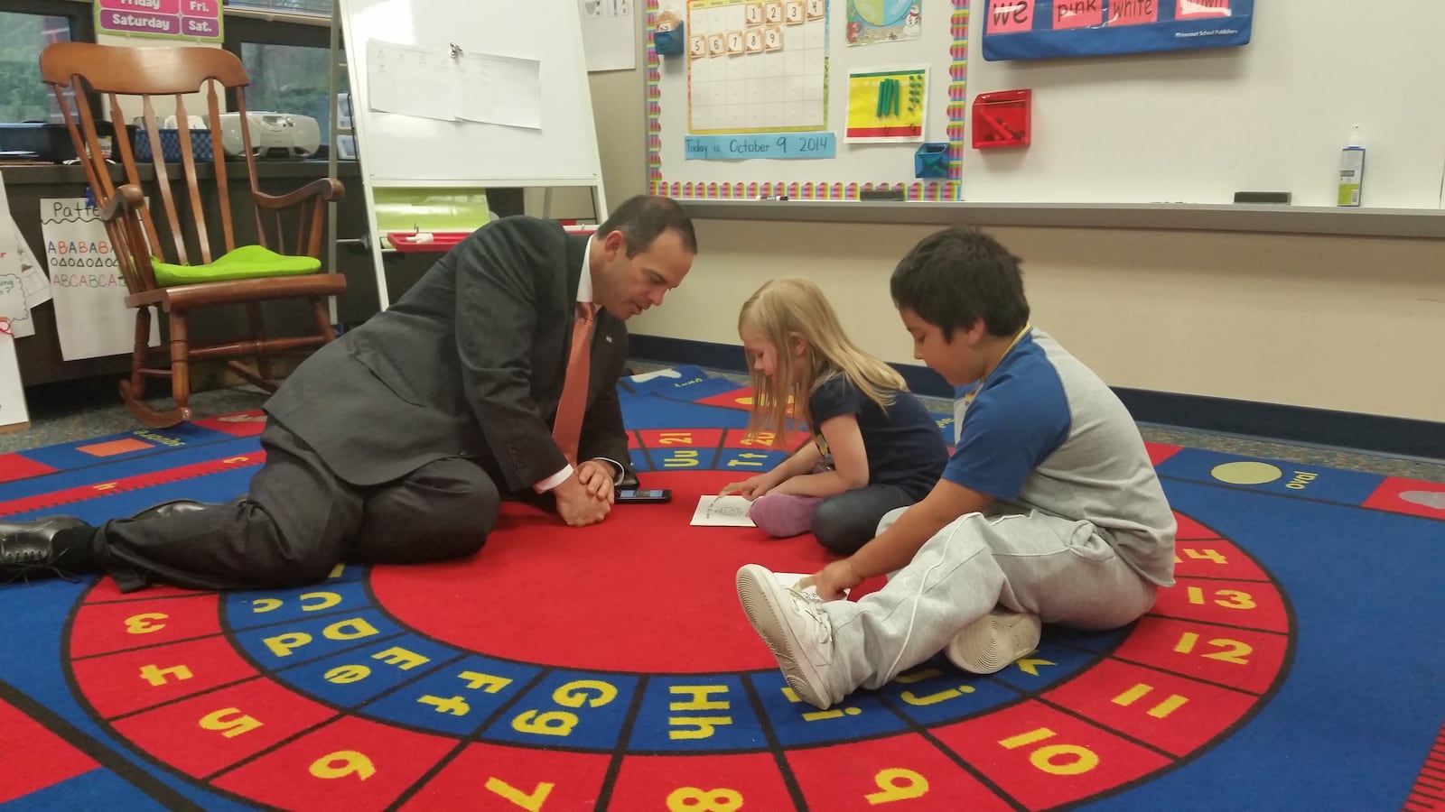 Wayne Township Superintendent Jeff Butts visits with students at Chapel Glen Elementary School in Indianapolis.