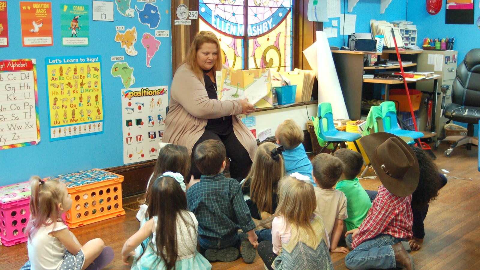 A teacher reads to students at Fuzzy Bear Ministry Preschool and Daycare in Ladoga, Indiana.