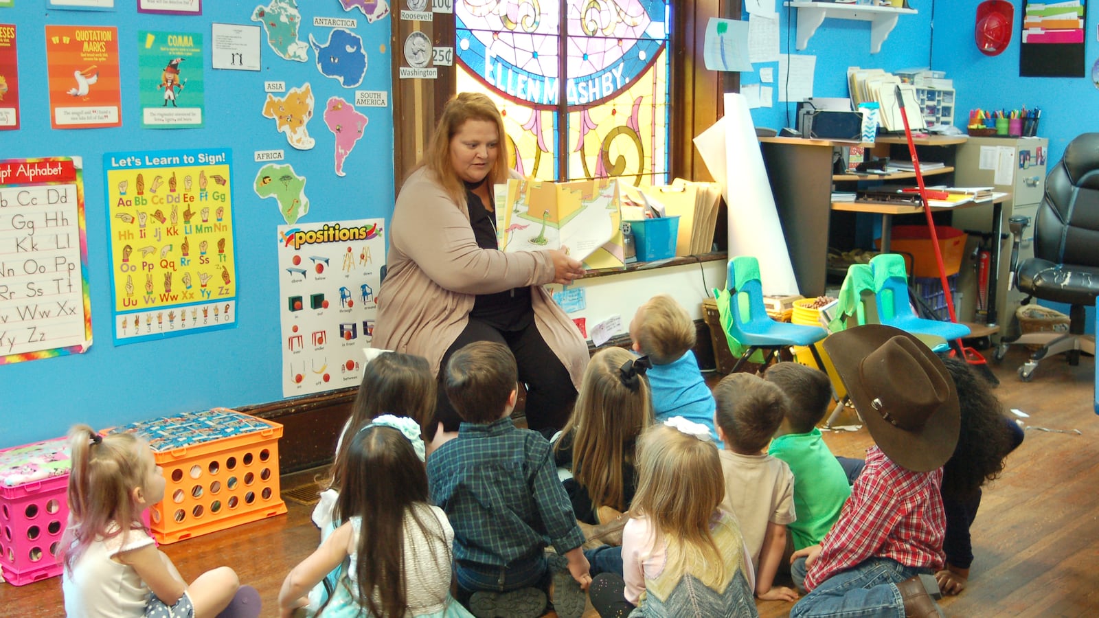 A teacher reads to students at Fuzzy Bear Ministry Preschool and Daycare in Ladoga, Indiana.