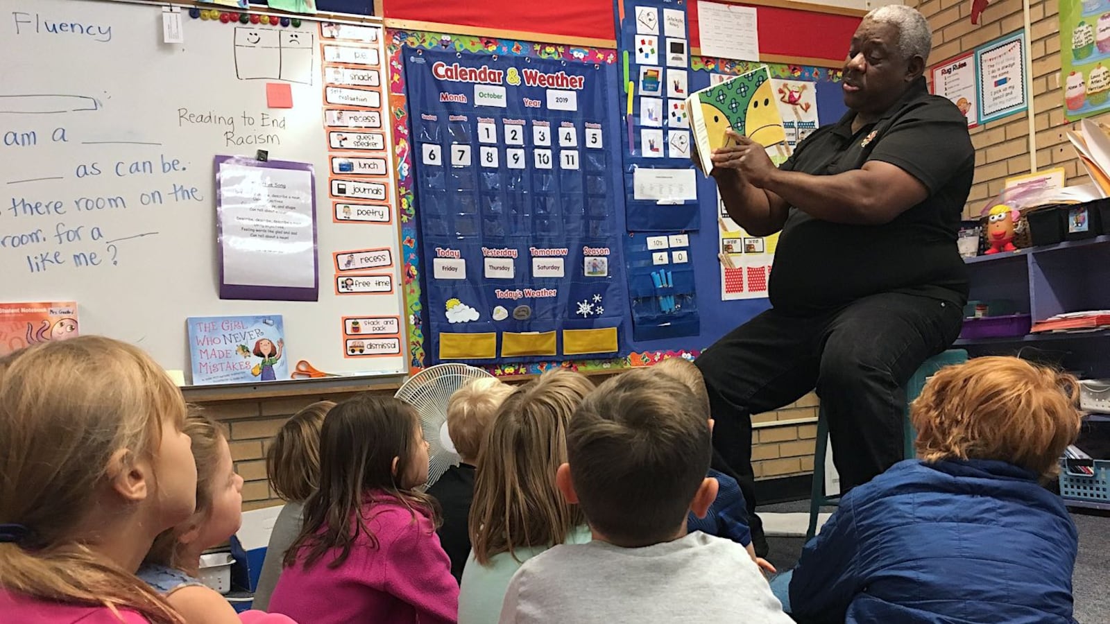 James Johnson, reads "Mr. Happy" to first-graders at Flatirons Elementary as part of the Reading to End Racism program.