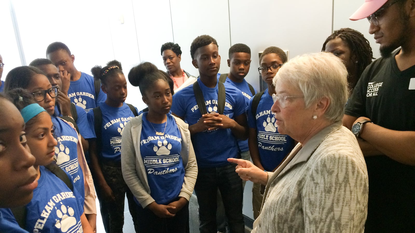 Former New York City Schools Chancellor Carmen Fariña asks students from Pelham Gardens Middle School about their favorite part of touring John Jay College of Criminal Justice. The tour was part of the College Access for All's program.