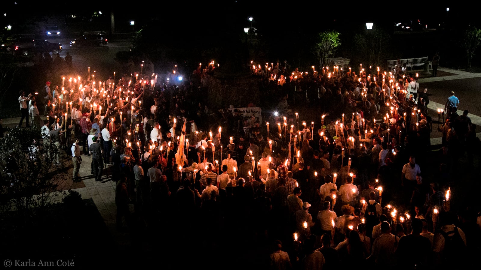 A white supremacist rally in Charlottesville surrounds a statue of Confederate Gen. Robert E. Lee.