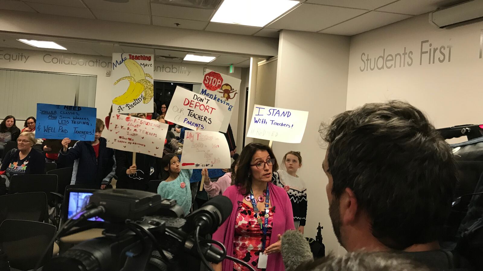 Denver Superintendent Susana Cordova speaks to news reporters  as union supporters stand behind her on Jan. 31, 2019.