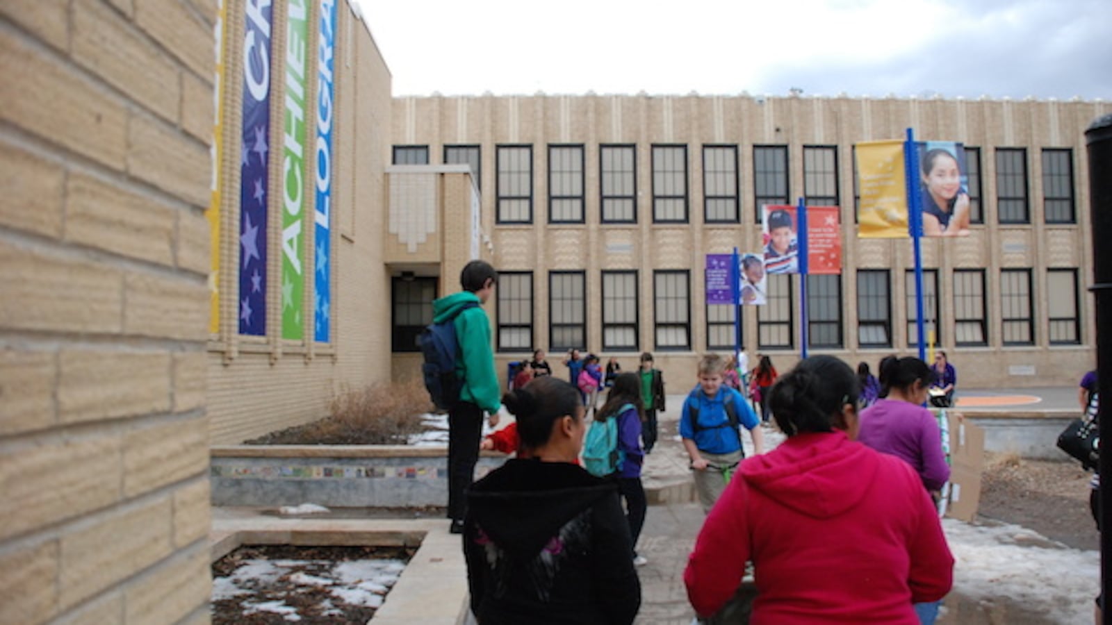 Parents pick up students at Ashley Elementary School in northeast Denver.