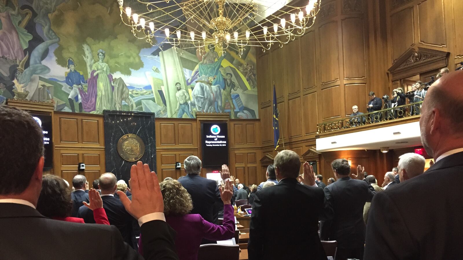 Indiana House Speaker Brian Bosma, R-Indianapolis, (right) and Rep. Todd Huston, R-Fishers, take the oath of office along with the rest of the House members during the annual Organization Day session to officially begin the 2017 legislative session.