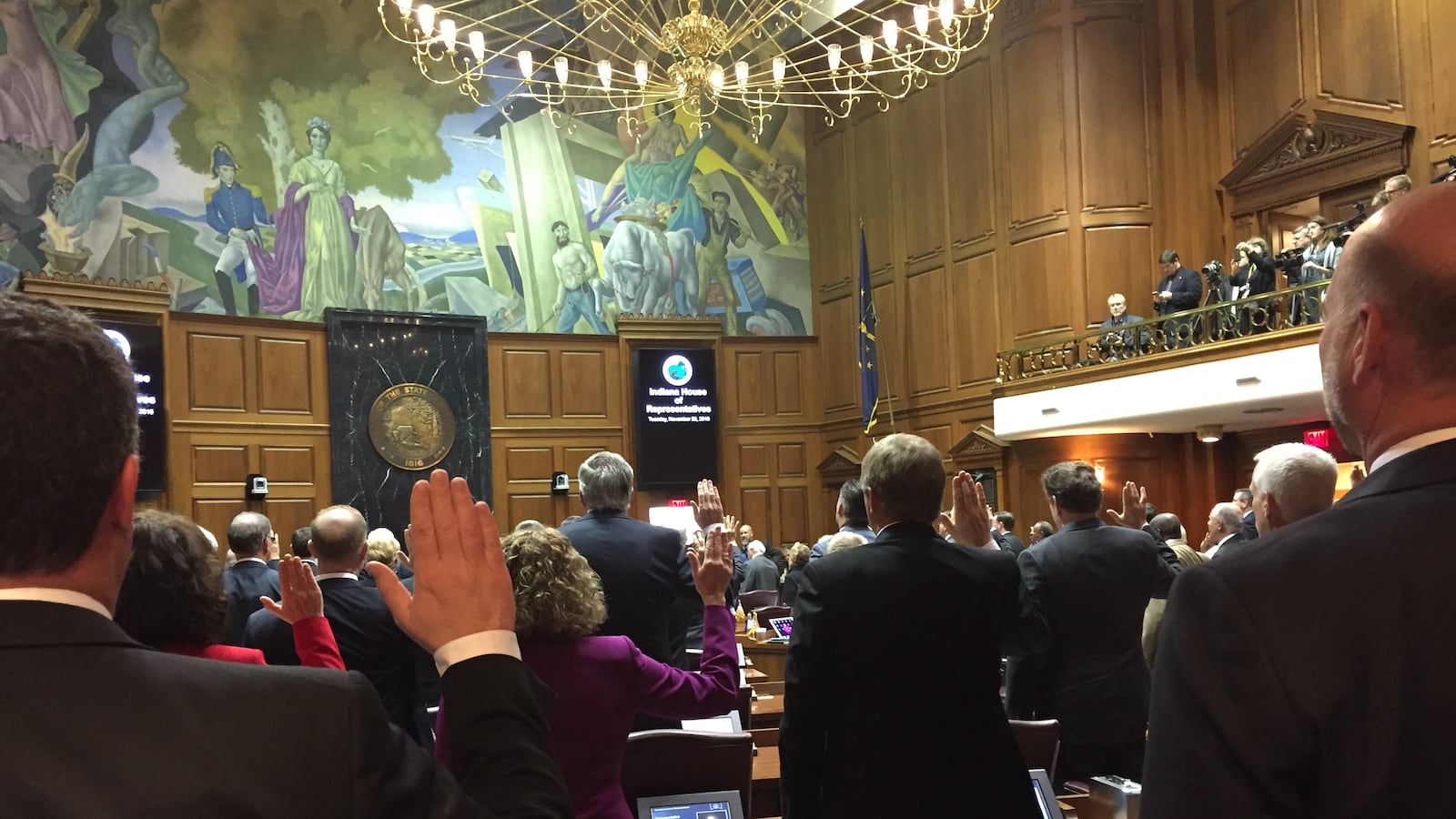 Indiana House Speaker Brian Bosma, R-Indianapolis, (right) and Rep. Todd Huston, R-Fishers, take the oath of office along with the rest of the House members during the annual Organization Day session to officially begin the 2017 legislative session.