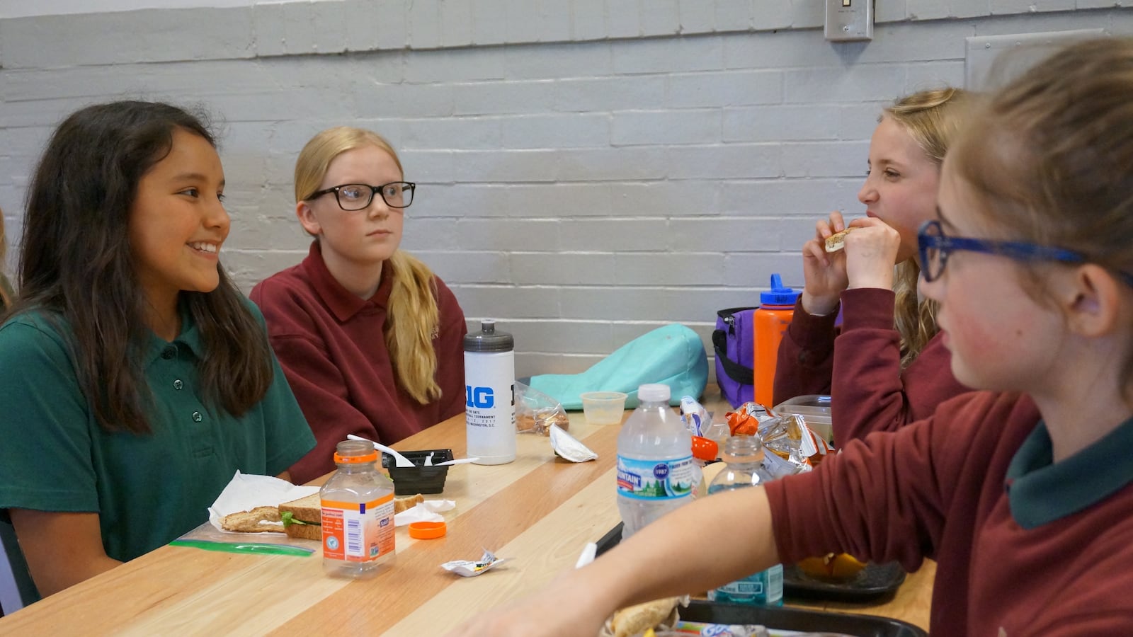 Students eat lunch at the Oaks Academy Middle School, a private Christian school that is integrated by design.