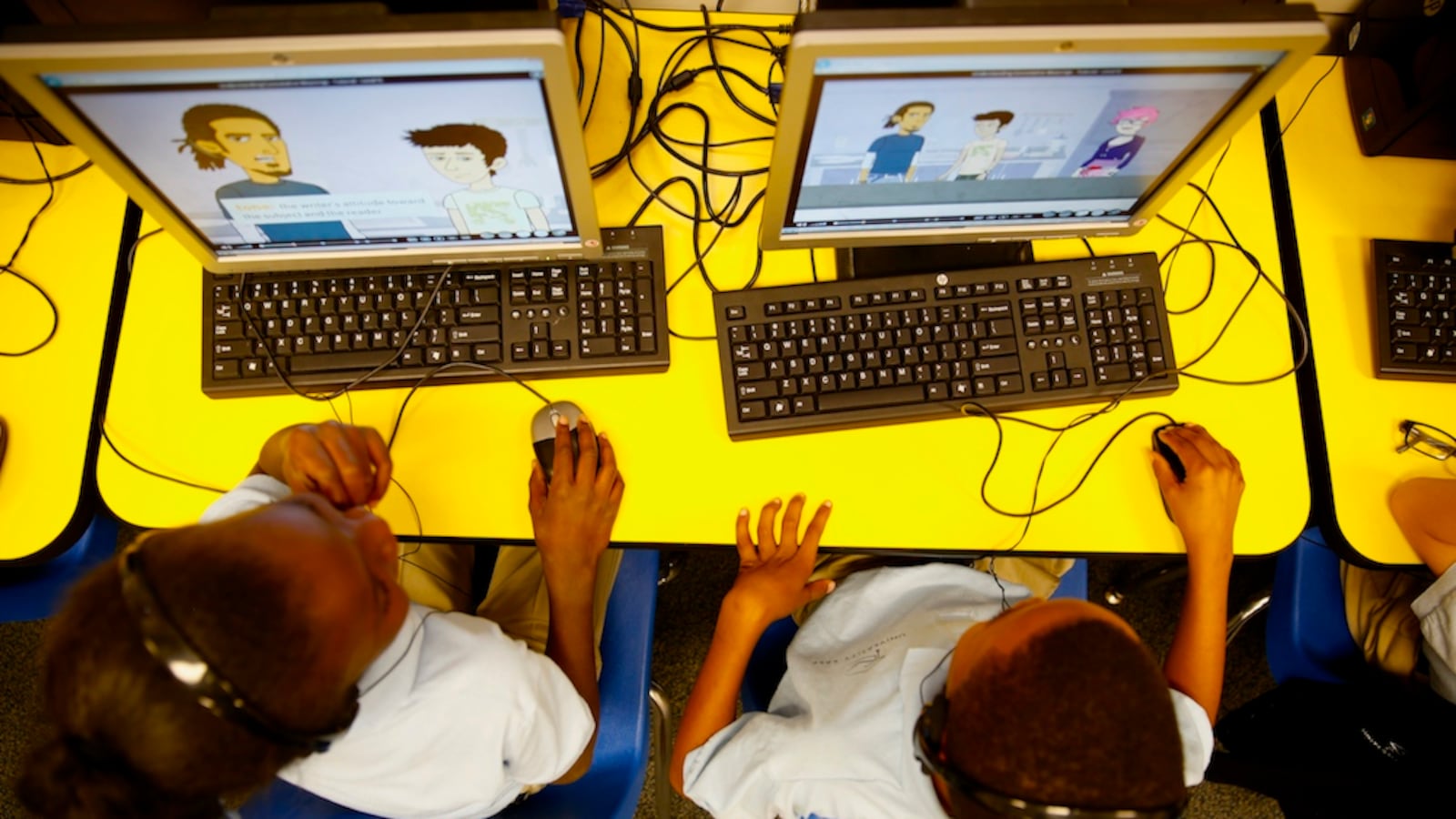 Students at University Prep, a Denver elementary charter school, work on a computer-based assignment .