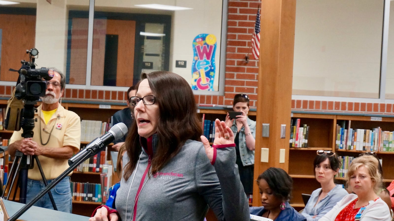 Adrianne Opp spoke in support of George Washington Community High School at a school board meeting Tuesday.