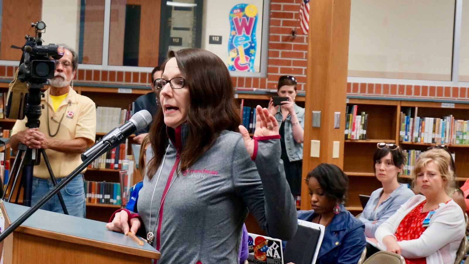 Adrianne Opp spoke in support of George Washington Community High School at a school board meeting Tuesday.