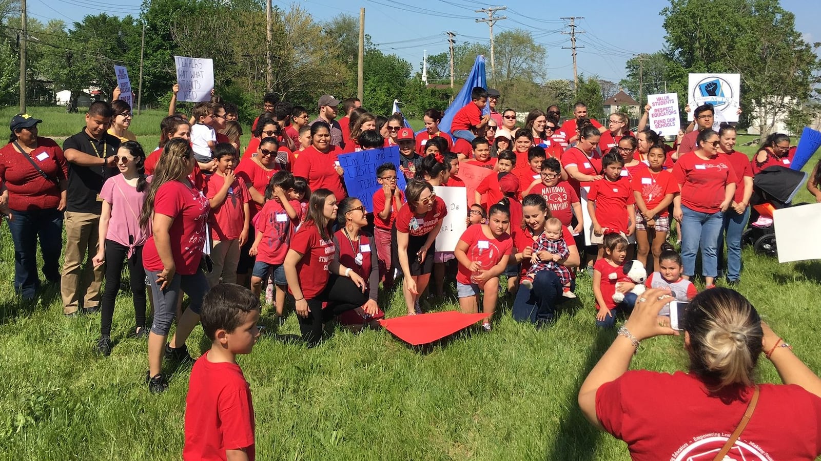 Southwest Detroit Community School families wearing union tee shirts gathered near the school in June before marching to demand a new  contract for teachers.