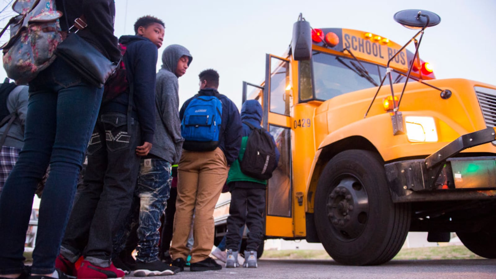 LOUISVILLE, KY: Students board a bus heading to Atherton High School in 2017 in Louisville, Kentucky. The Kentucky GOP-led state House had just passed a bill that requiring Jefferson County to return to neighborhood schooling, undoing the county's longstanding desegregation efforts.