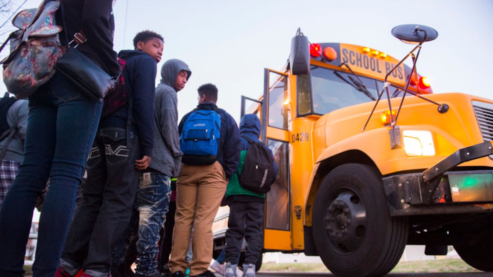 LOUISVILLE, KY: Students board a bus heading to Atherton High School in 2017 in Louisville, Kentucky. The Kentucky GOP-led state House had just passed a bill that requiring Jefferson County to return to neighborhood schooling, undoing the county's longstanding desegregation efforts.