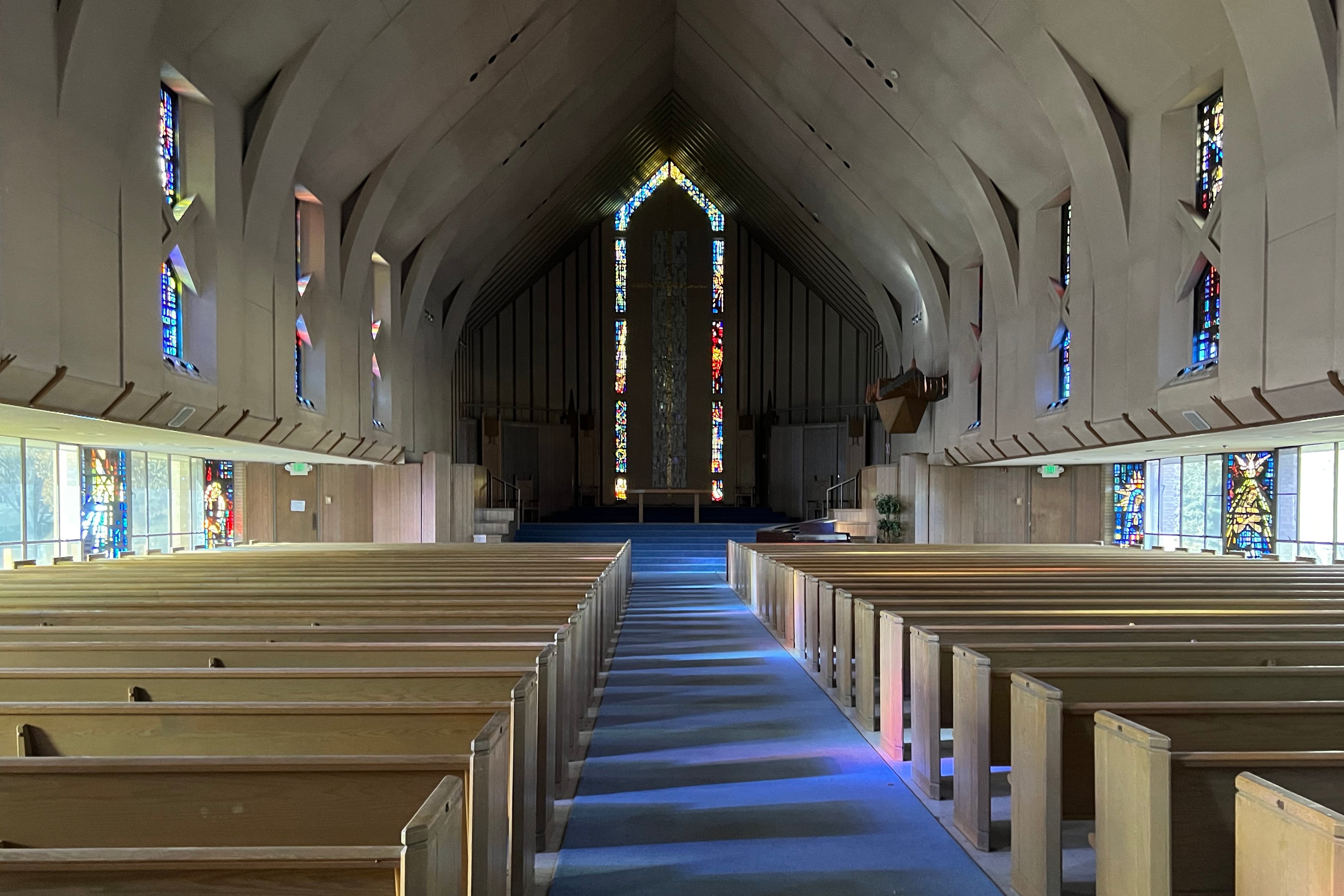 Rows of pews in a Chapel.