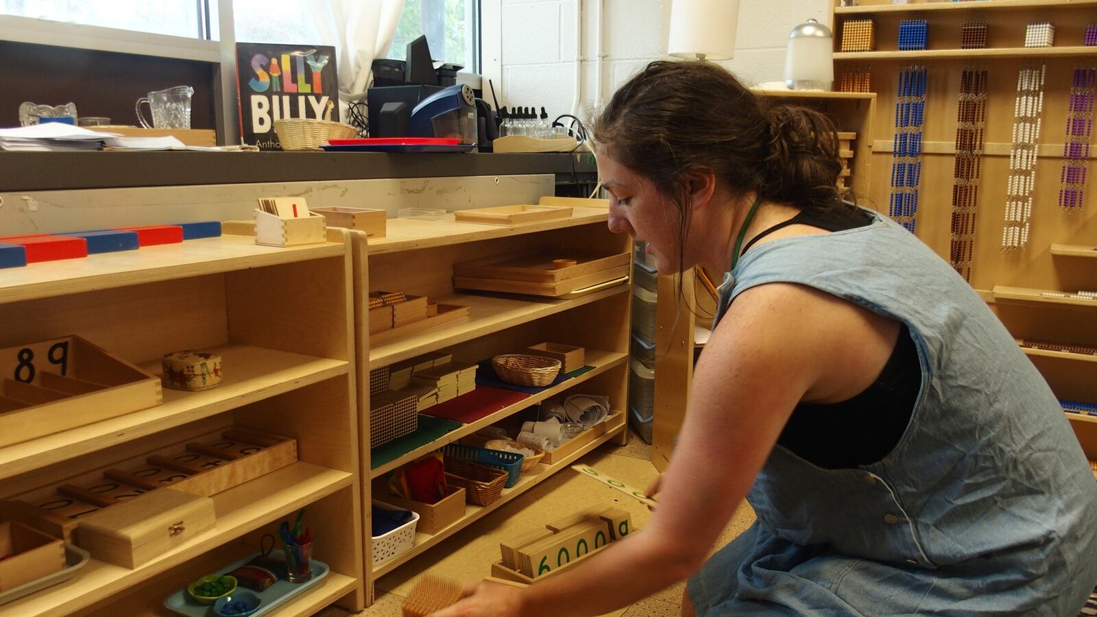 Tori Long, who teaches special education at Libertas, demonstrates how the Montessori method's emphasis on hands-on learning can make learning concepts like addition and division more accessible to students.