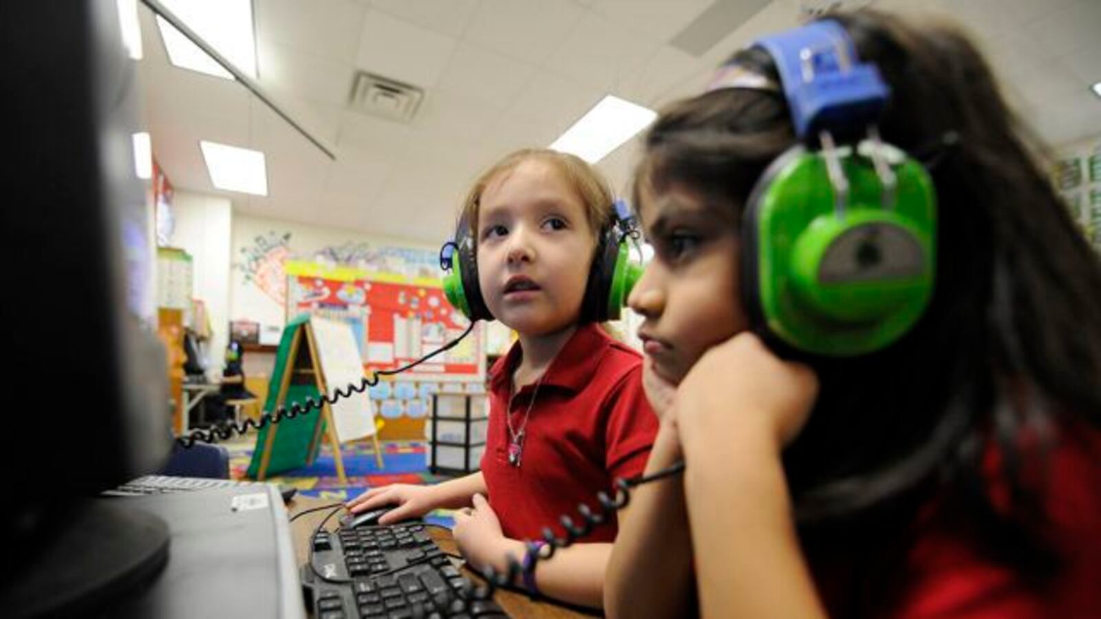 Kindergarteners using the computer at IPS School 90.