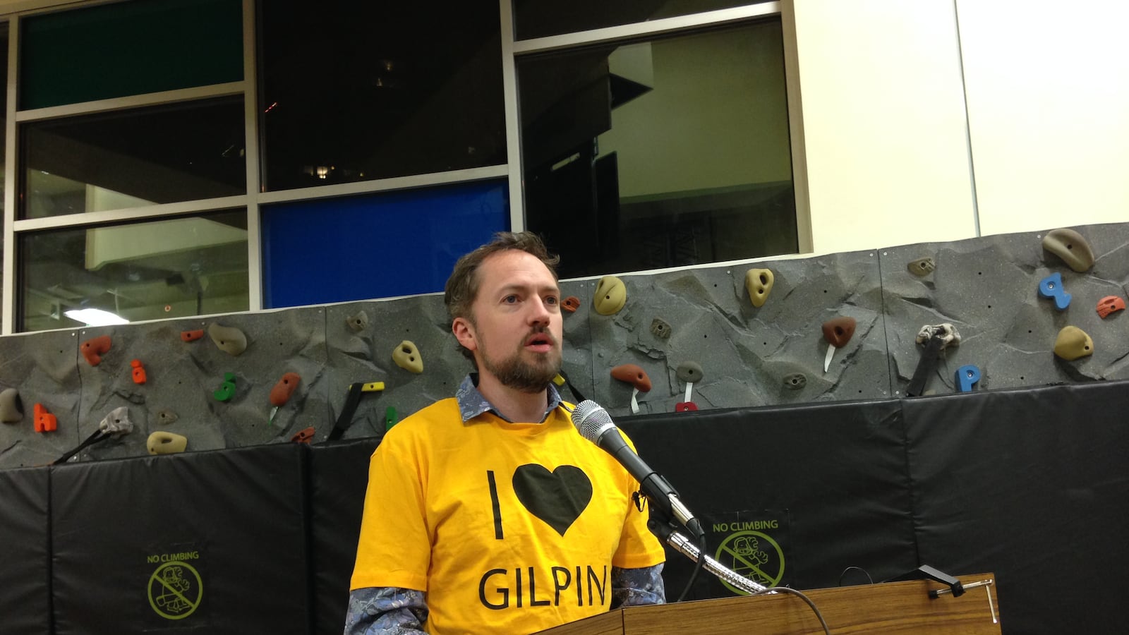 A Gilpin supporter addresses the school board before the closure vote in December.
