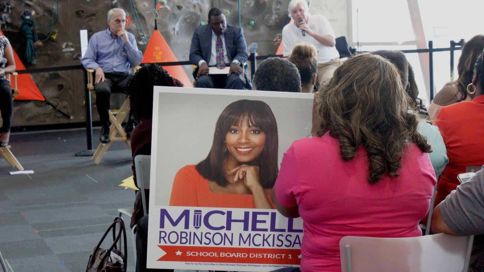 A supporter holds a sign for District 1 candidate Michelle Robinson McKissack at Chalkbeat’s forum for MSCS board candidates in 2020. McKissack won a second term - and recently announced her candidacy for Memphis mayor.
