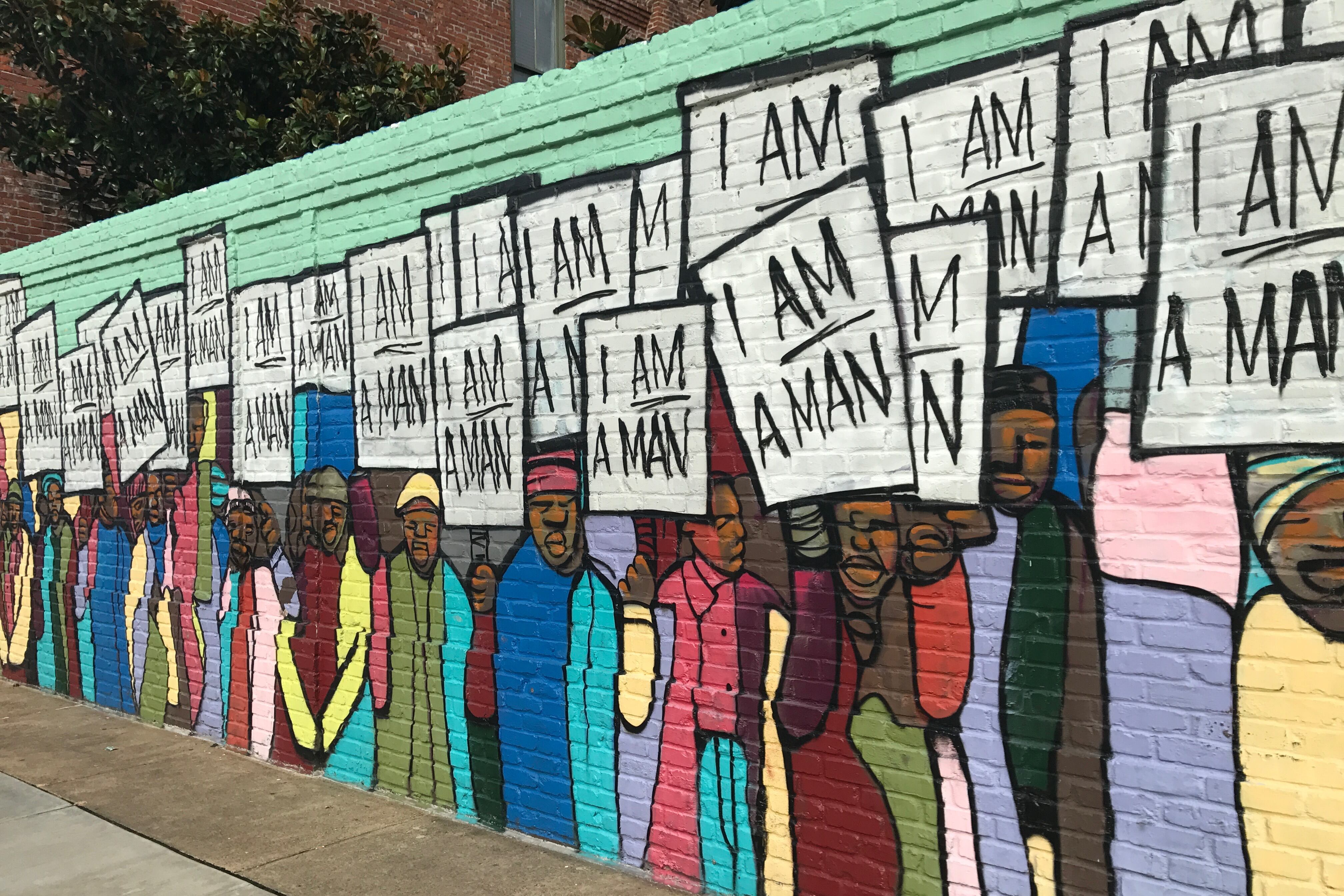 A mural paying homage to the 1968 sanitation worker strike in Memphis is near the National Civil Rights Museum, where the Philanthropy Roundtable sponsored part of its 2017 forum on K-12 education investments. The mural is by Marcellous Lovelace.