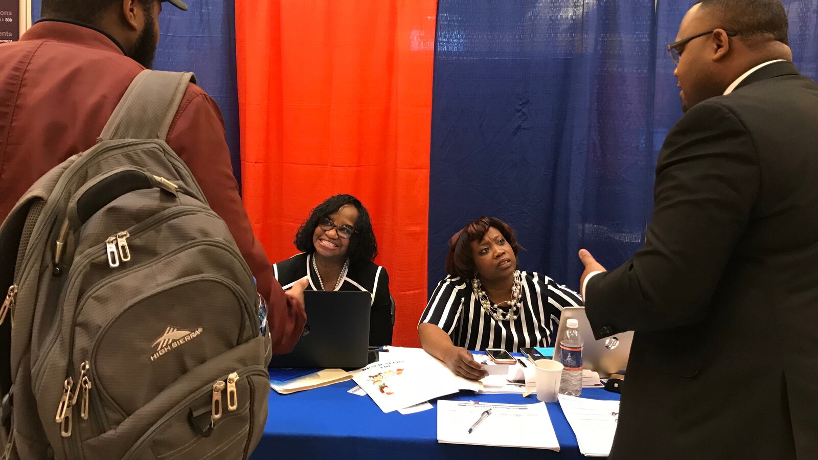 Recruiters Edwina Dortch and Asenath Jones chat with passersby at Morgan State University's spring career fair
