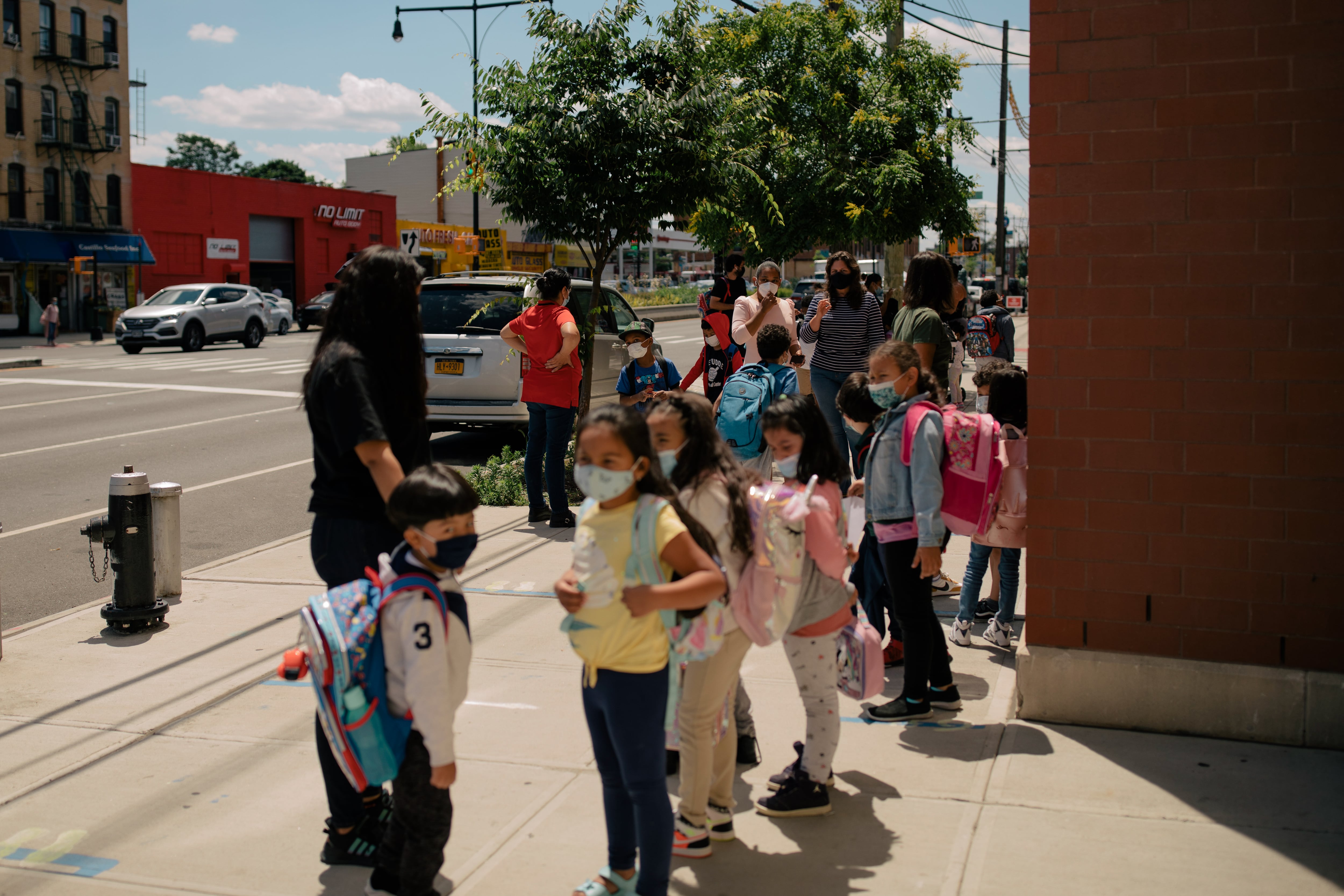 Students at P.S. 89 in Brooklyn await their families at the end of the school day during the last week of New York City’s 2020-2021 school year.