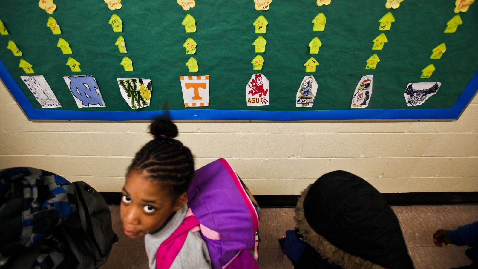 Student gazes at camera.
