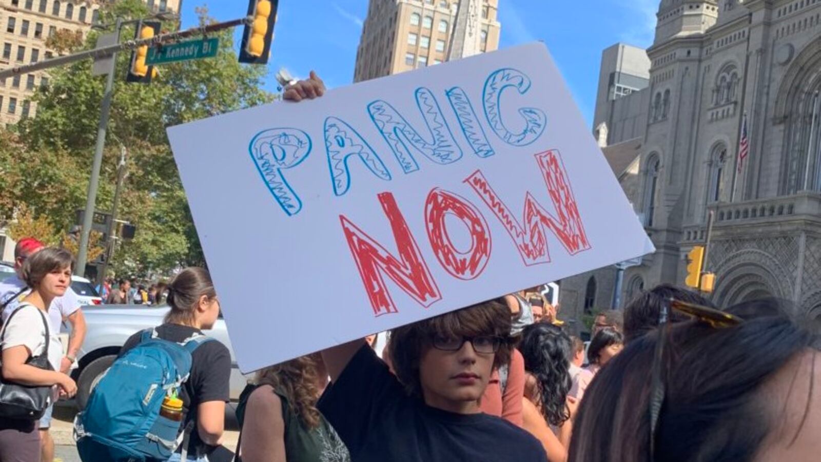 A “Panic now” sign reflects the urgency of young people who are worried about the future of the Earth.