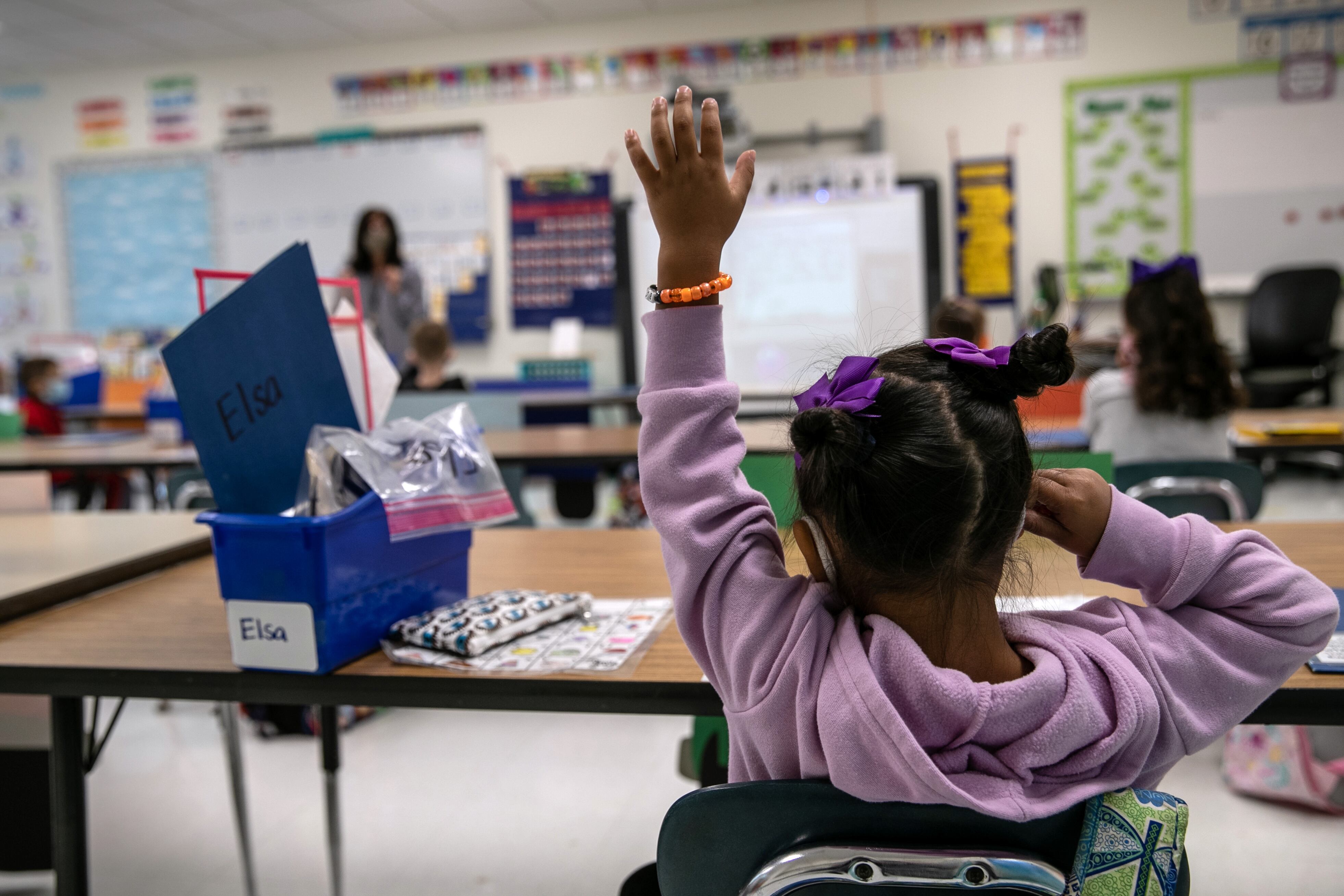 A first-grader attends class at a Connecticut elementary school in mid-September as part of a hybrid schedule.