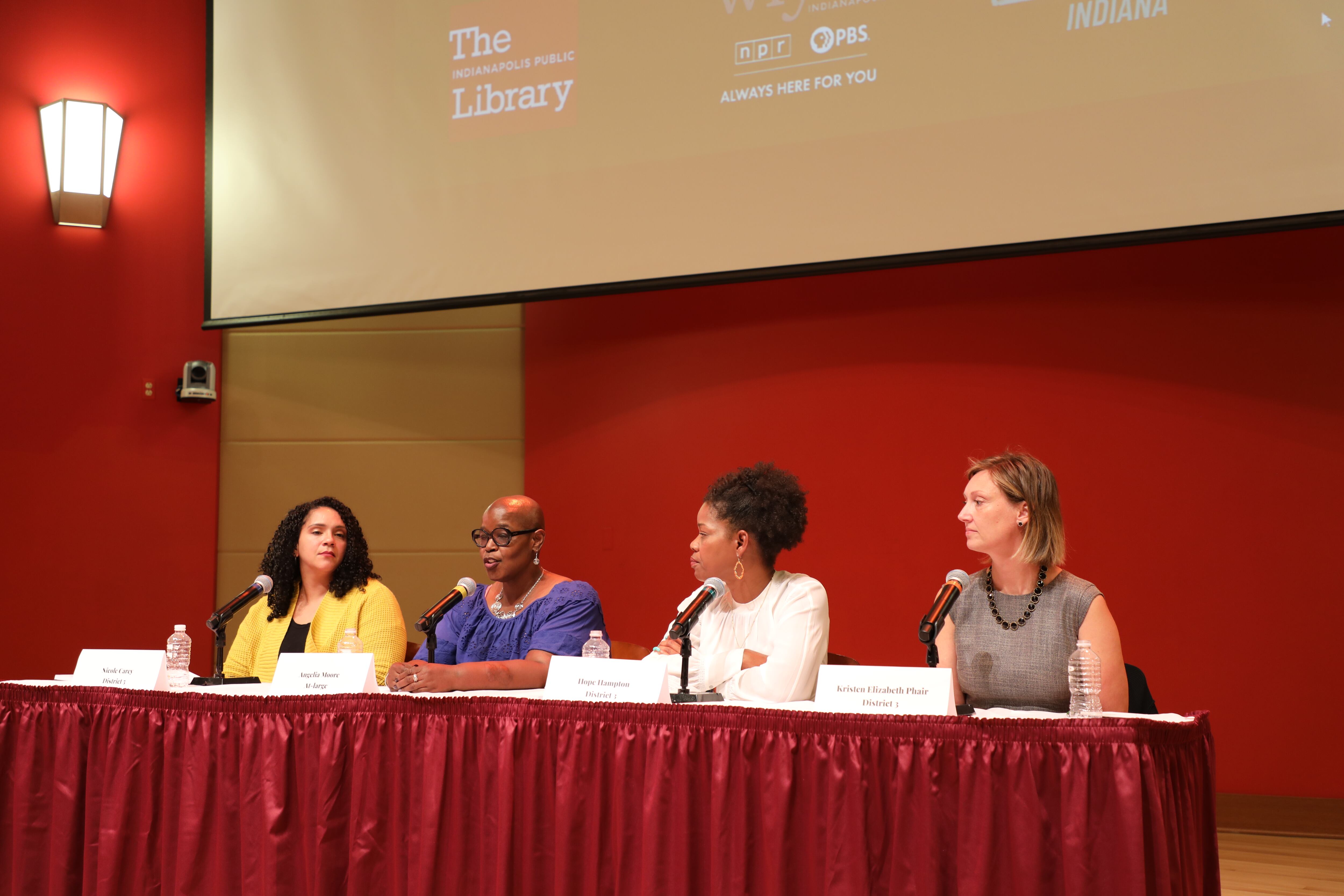 Four candidates at a table