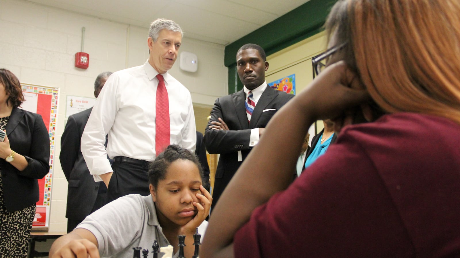 U.S. Education Secretary Arne Duncan talks Friday with Lionel Cable, principal of Douglass K-8 Optional School in Memphis and part of the Innovation Zone for Shelby County Schools.