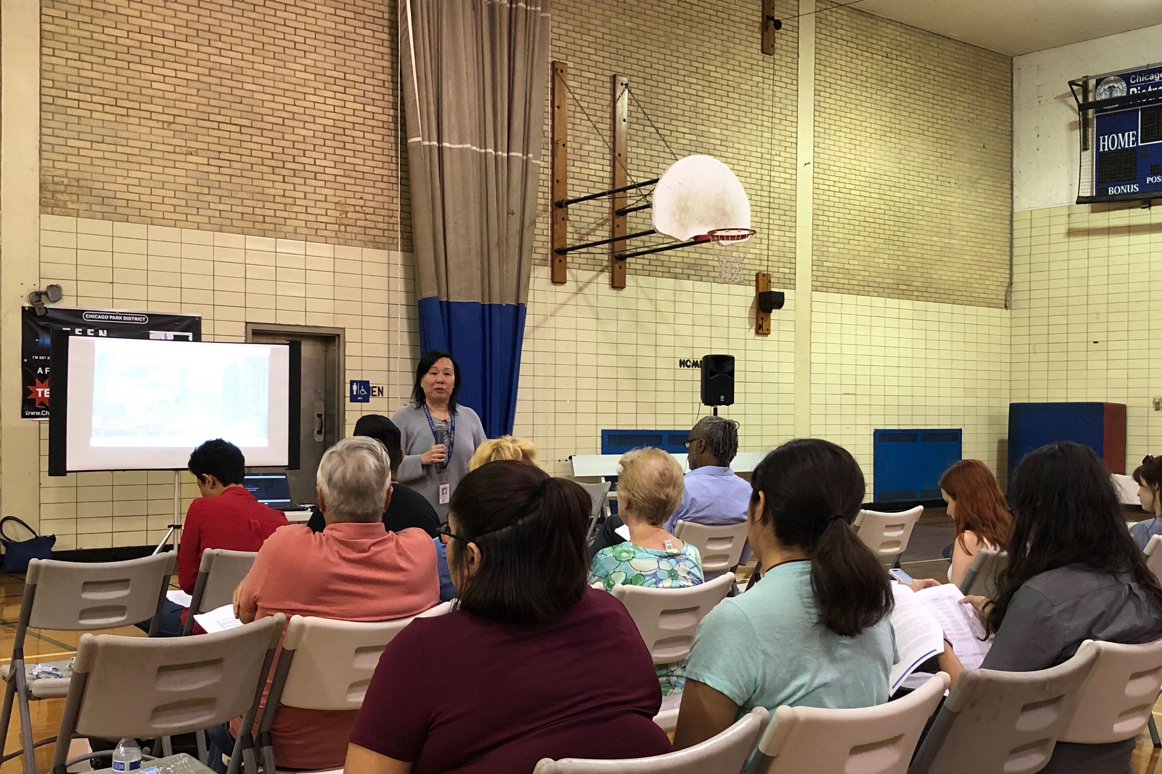 Chicago Public Schools’ safety and security chief Jadine Chou speaks at a community meeting on Chicago’s school police program.
