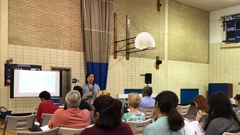 Chicago Public Schools’ safety and security chief Jadine Chou speaks at a community meeting on Chicago’s school police program.