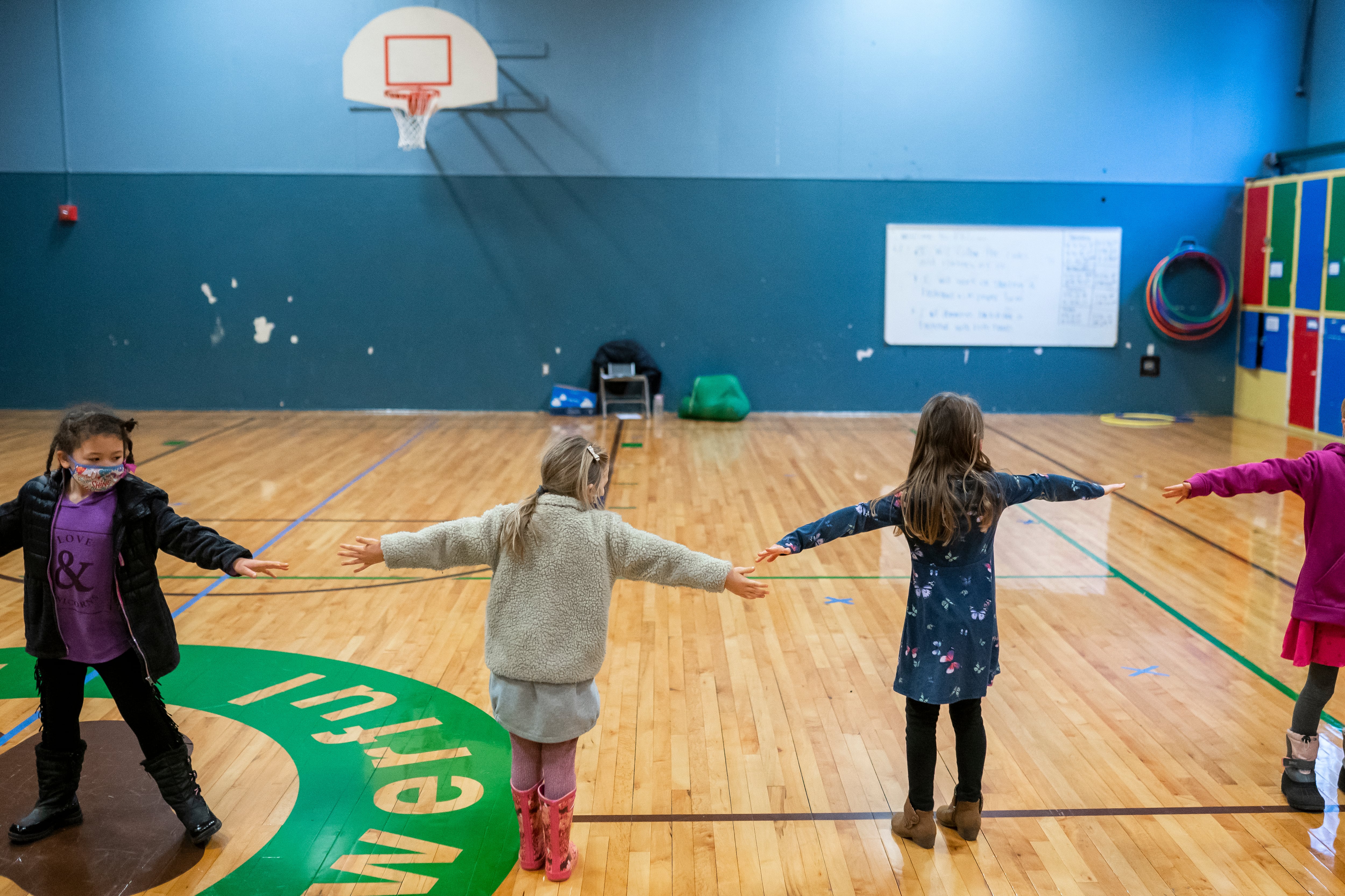 WOODLAND, WA - FEBRUARY 18: First grade students at the Green Mountain School practice social distancing during recesses on February 18, 2021 in Woodland, Washington. Washington state loosened in-person learning guidelines in December, sending elementary and middle school students back to the classroom a few days each week.