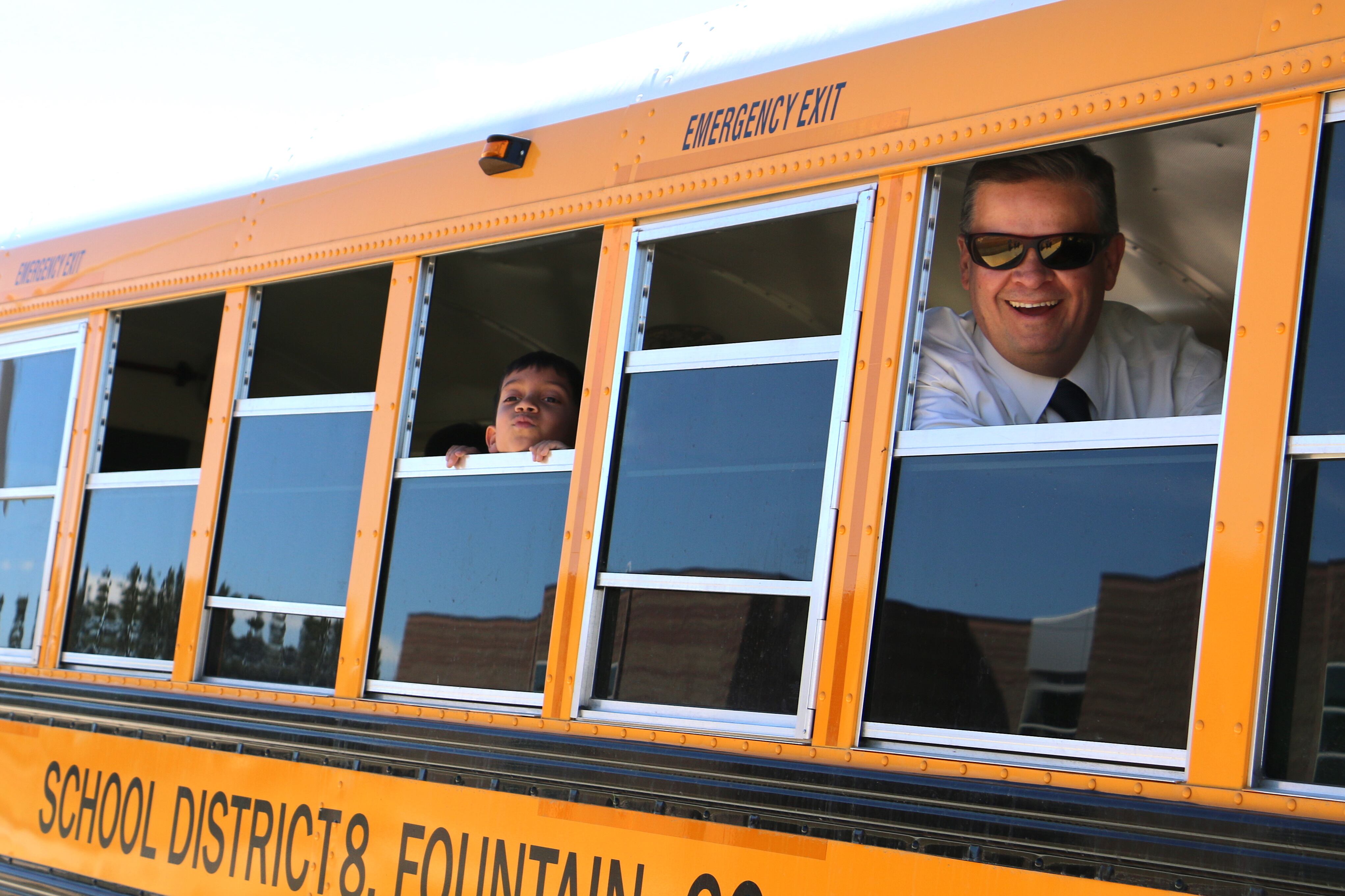 School superintendent Keith Owen looks out a school bus window