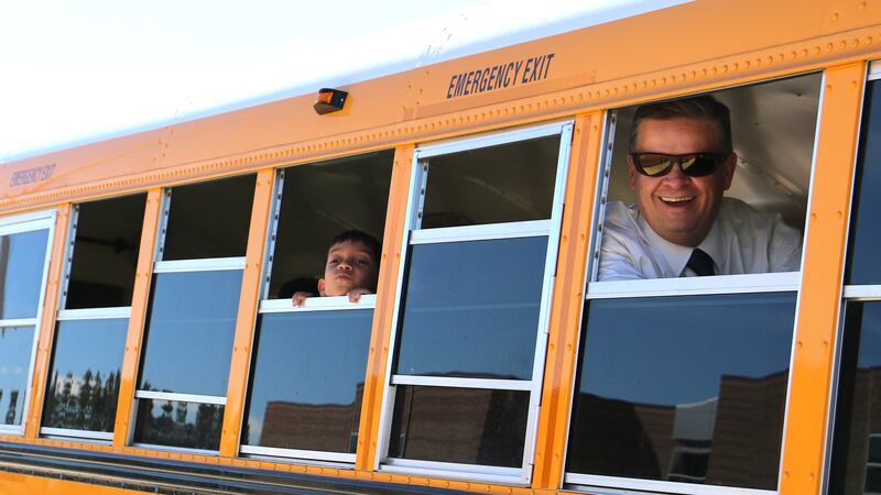 School superintendent Keith Owen looks out a school bus window