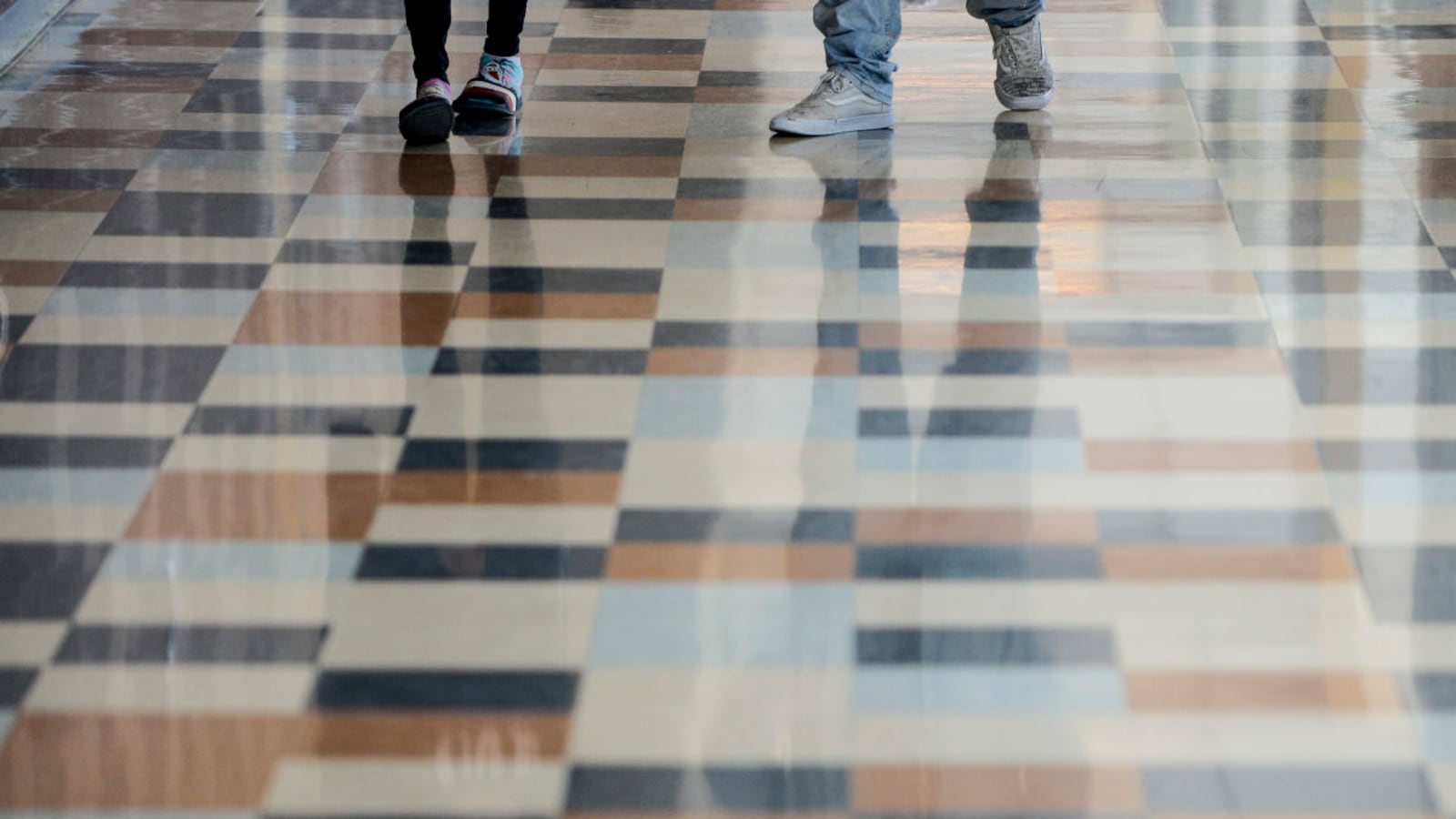 Students walk through the hall at Adams City High School Monday, Feb. 4, 2019 in Commerce City.