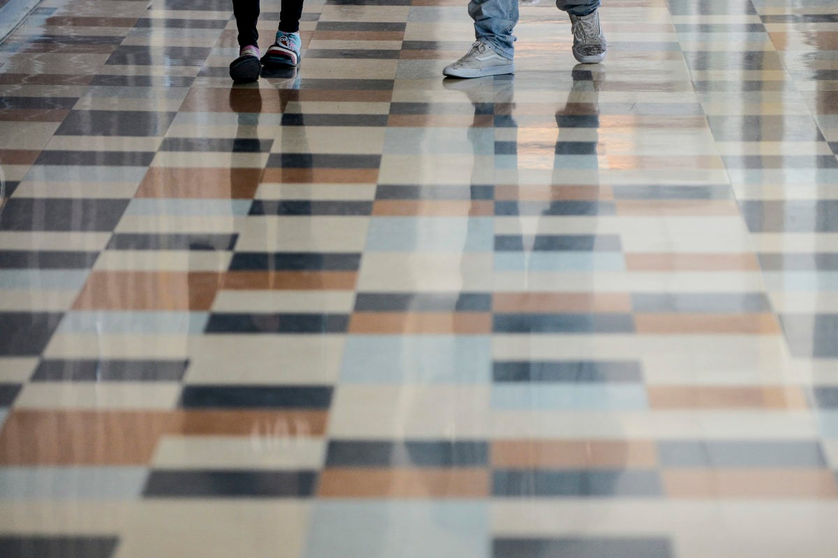 Students walk through the hall at Adams City High School Monday, Feb. 4, 2019 in Commerce City.