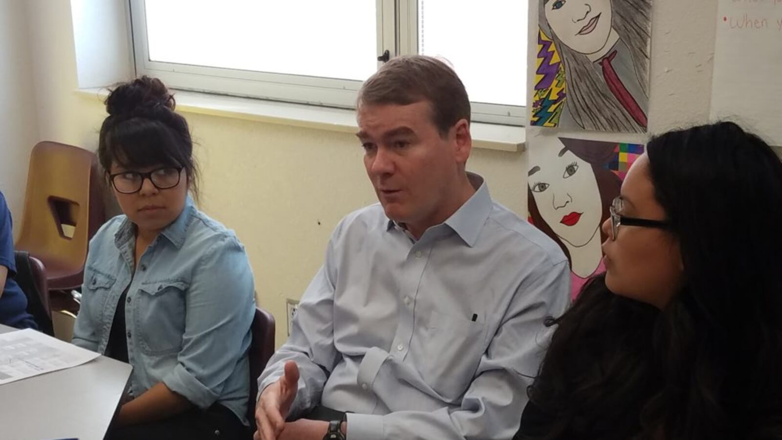 Michael Bennett speaks to high school seniors at Bruce Randolph School in 2017.