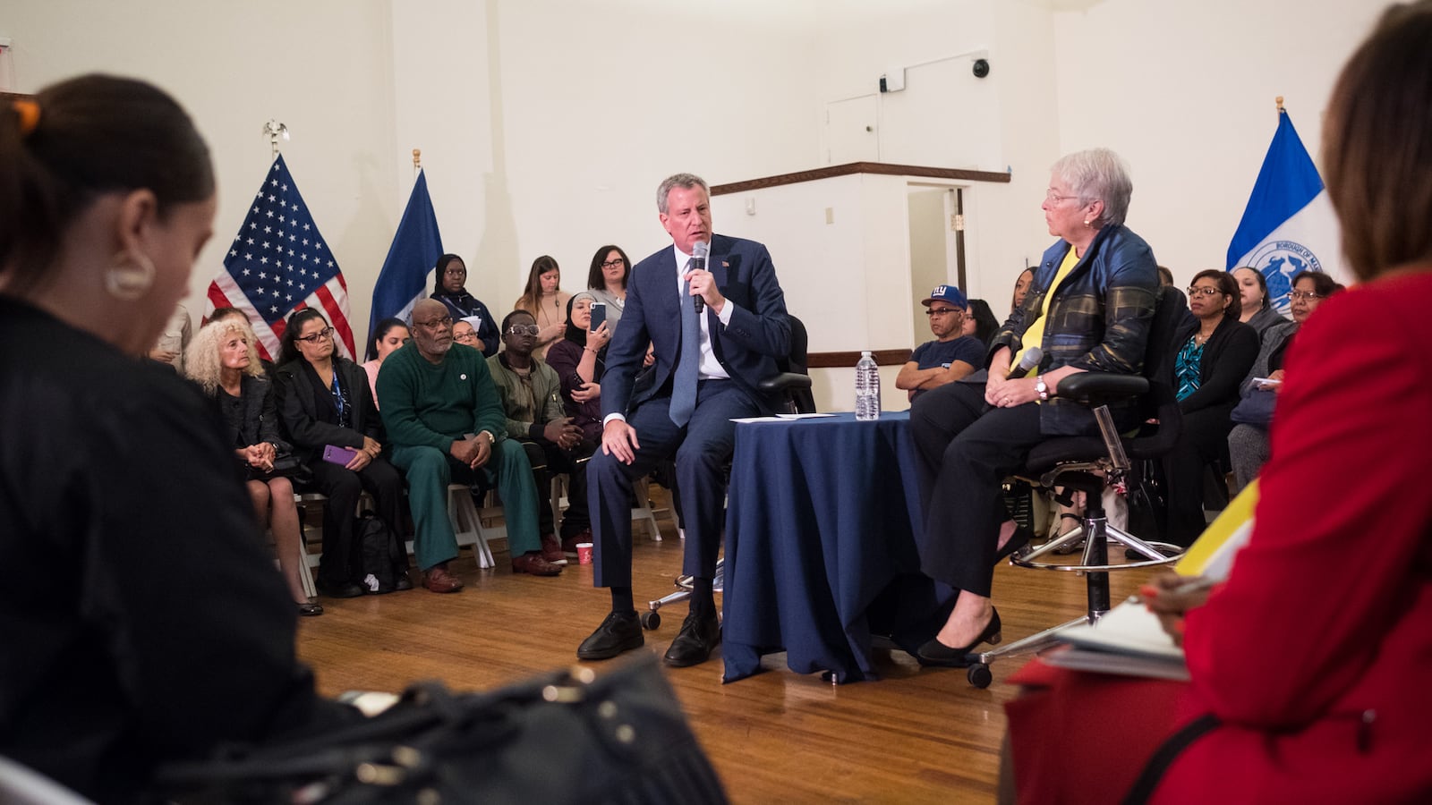 Mayor Bill de Blasio and Chancellor Carmen Fariña speak with parent leaders about school safety at the Harry Belafonte Library in October.