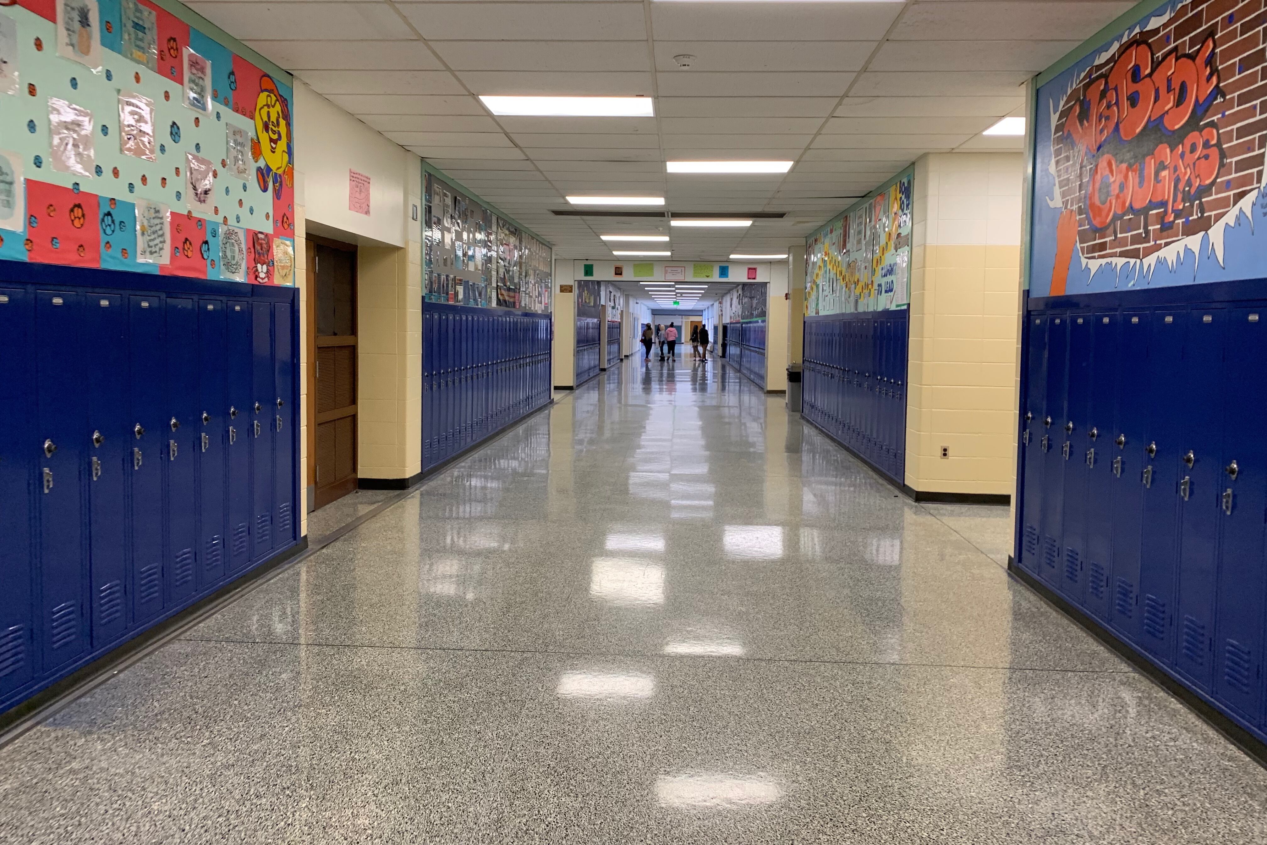 Students walk down a mostly empty hallway in Gary’s West Side Leadership Academy in December 2019.