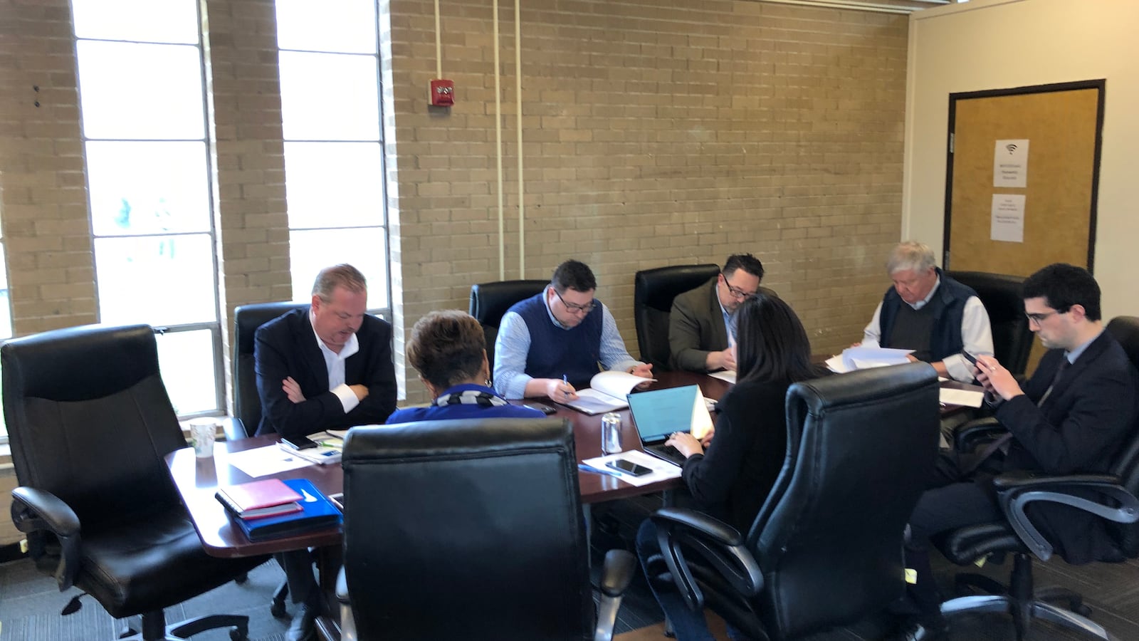 A meeting of the board of Detroit Collegiate Academy, a charter school, on April 18. During the meeting, a social worker urged the board reconsider the expulsion of a student.