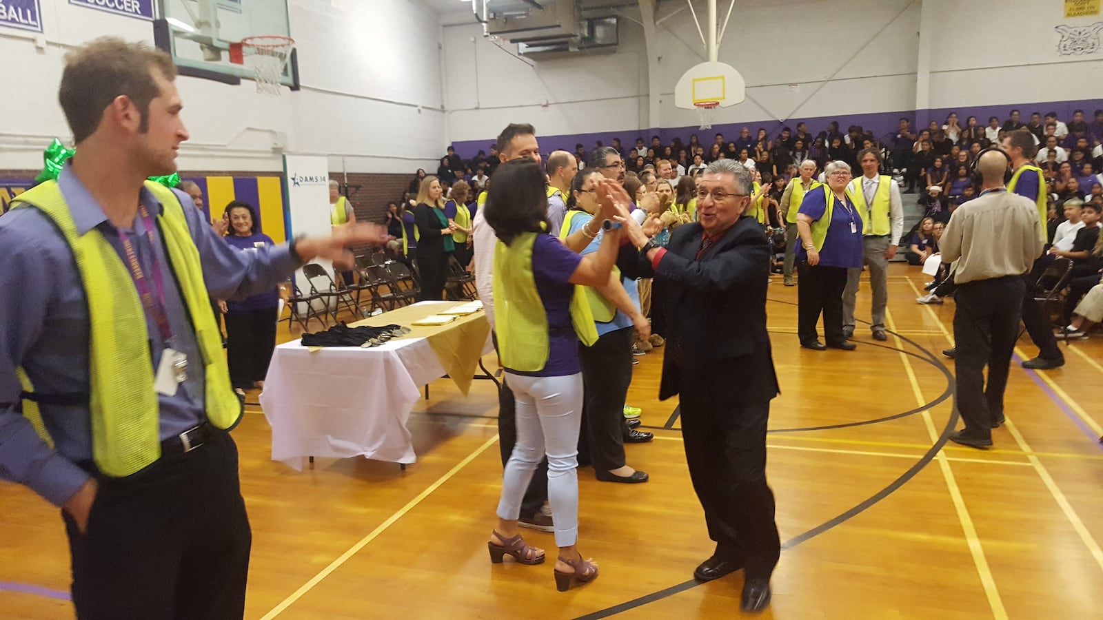 Adams 14 Superintendent Javier Abrego celebrates with teachers at Kearney Middle School during an event highlighting the school's rating in August 2017. (Photo by Yesenia Robles, Chalkbeat)