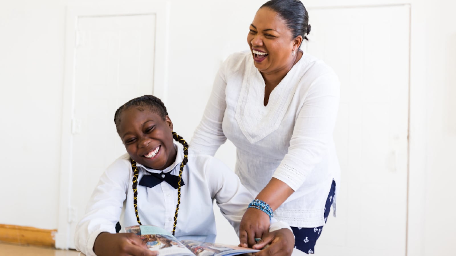 WE Teacher Award Recipient Nadine Lewis-Knight smiles with a student.