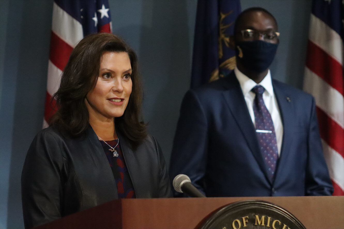Michigan Governor Gretchen Whitmer speaks at a podium.
