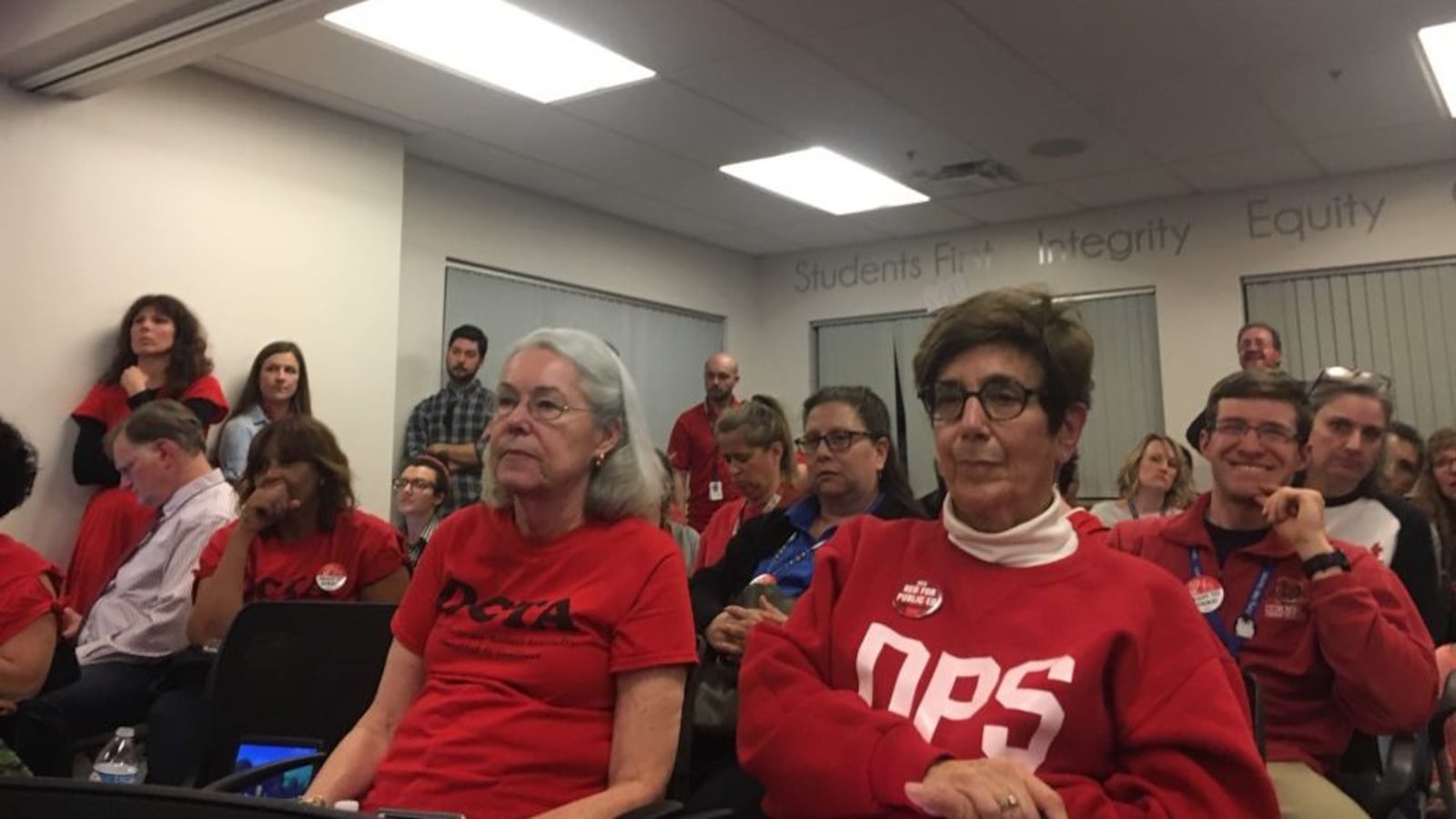 Denver teachers listen to an update on bargaining during the second to last day of negotiations before the ProComp contract expires.