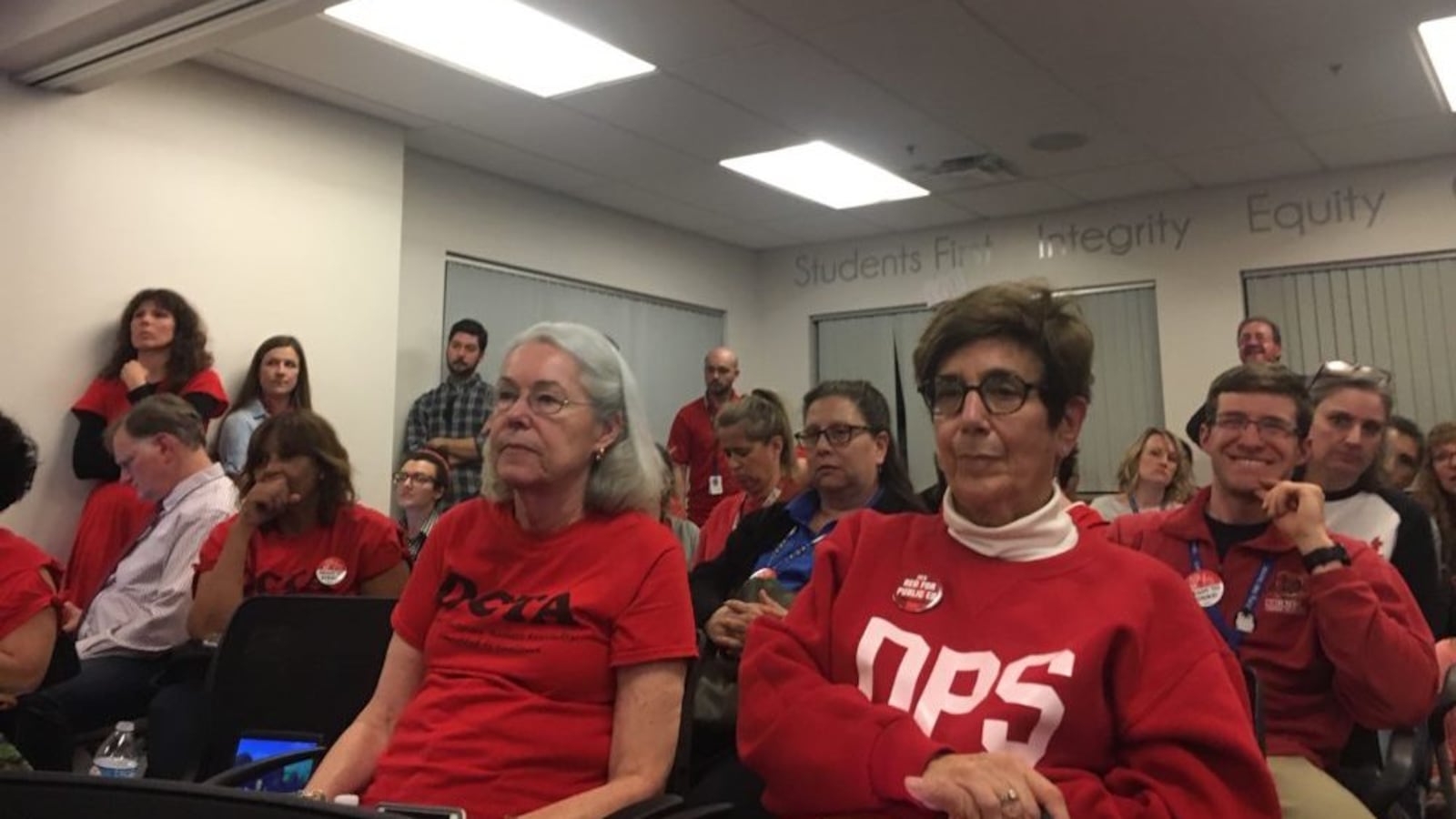 Denver teachers listen to an update on bargaining during the second to last day of negotiations before the ProComp contract expires.
