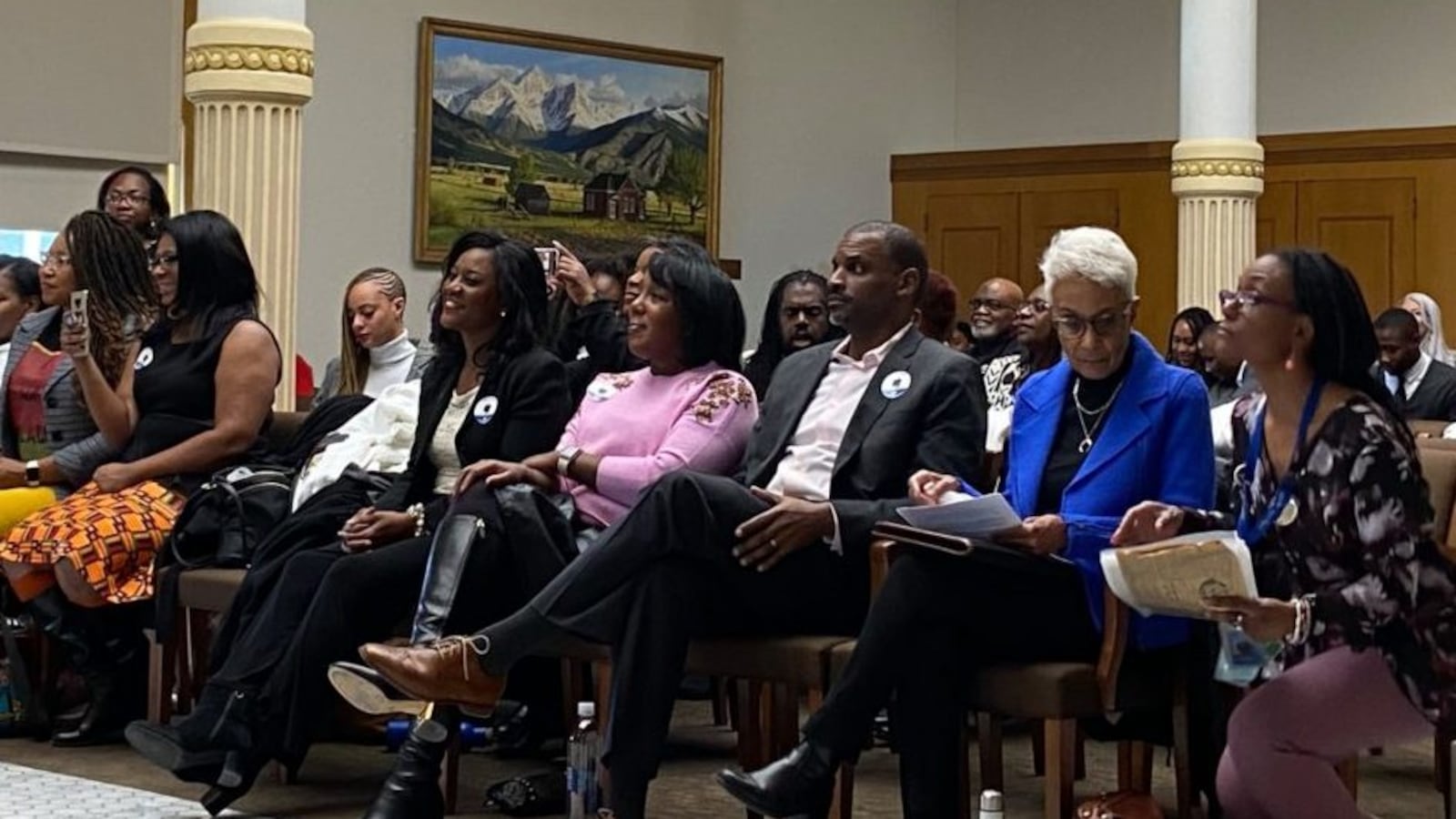 Community members and civic leaders wait to testify in support of the Colorado Crown Act, which would ban discrimination against natural hairstyles at work and in school.