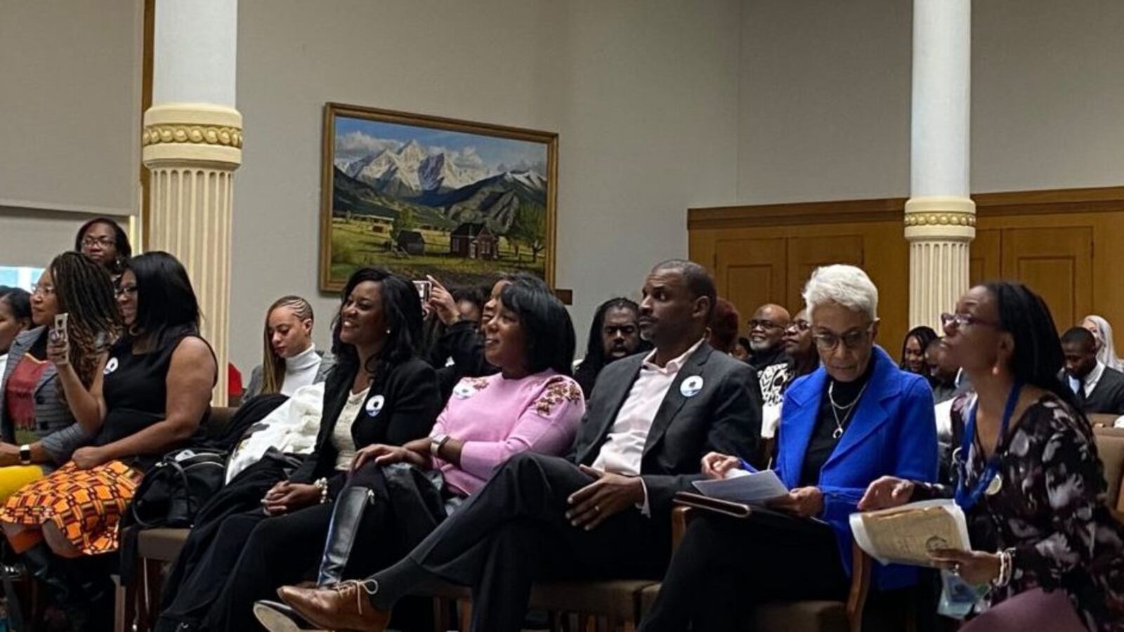 Community members and civic leaders wait to testify in support of the Colorado Crown Act, which would ban discrimination against natural hairstyles at work and in school.