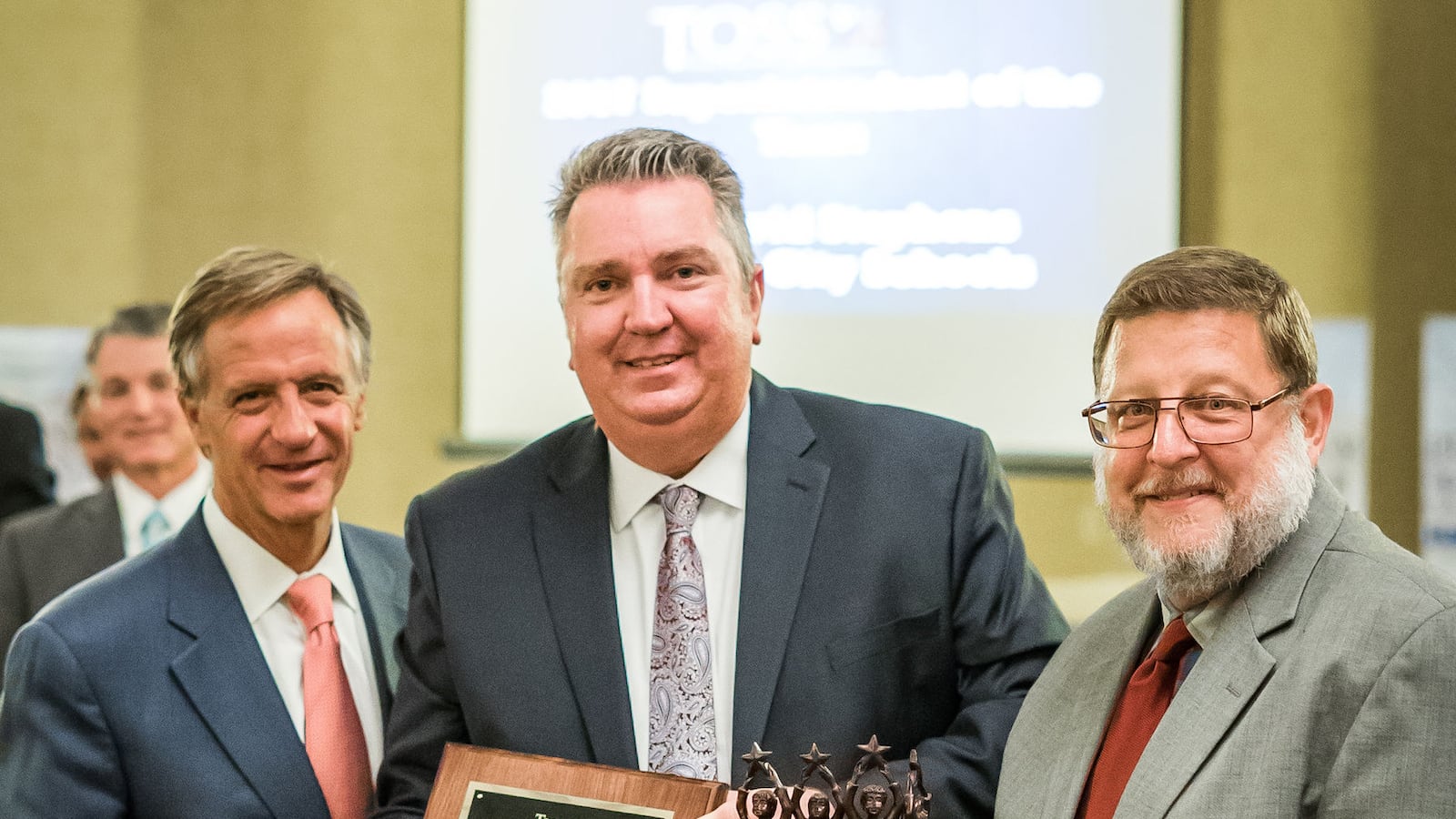 Bartlett City Schools Superintendent David Stephens (center) receives Tennessee's Superintendent of the Year award from Gov. Bill Haslam and Wayne Miller, executive director of the Tennessee Organization of School Superintendents.