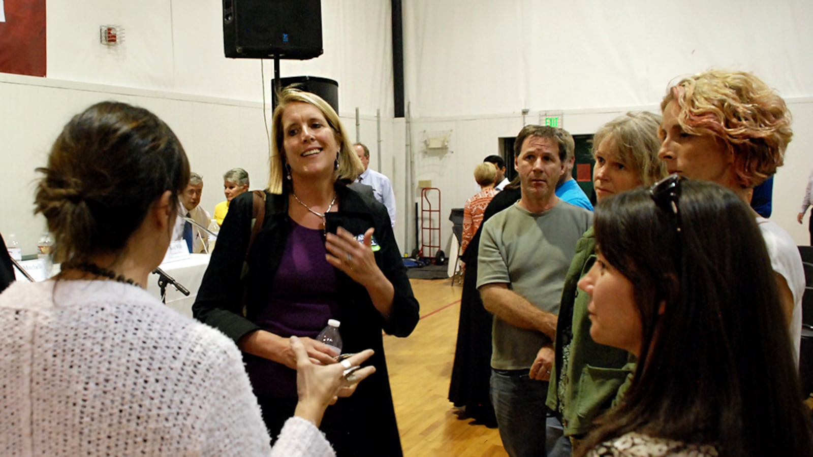 Jeffco school board candidate Ali Lasell, center left, speaks to charter school parents at a forum in September.